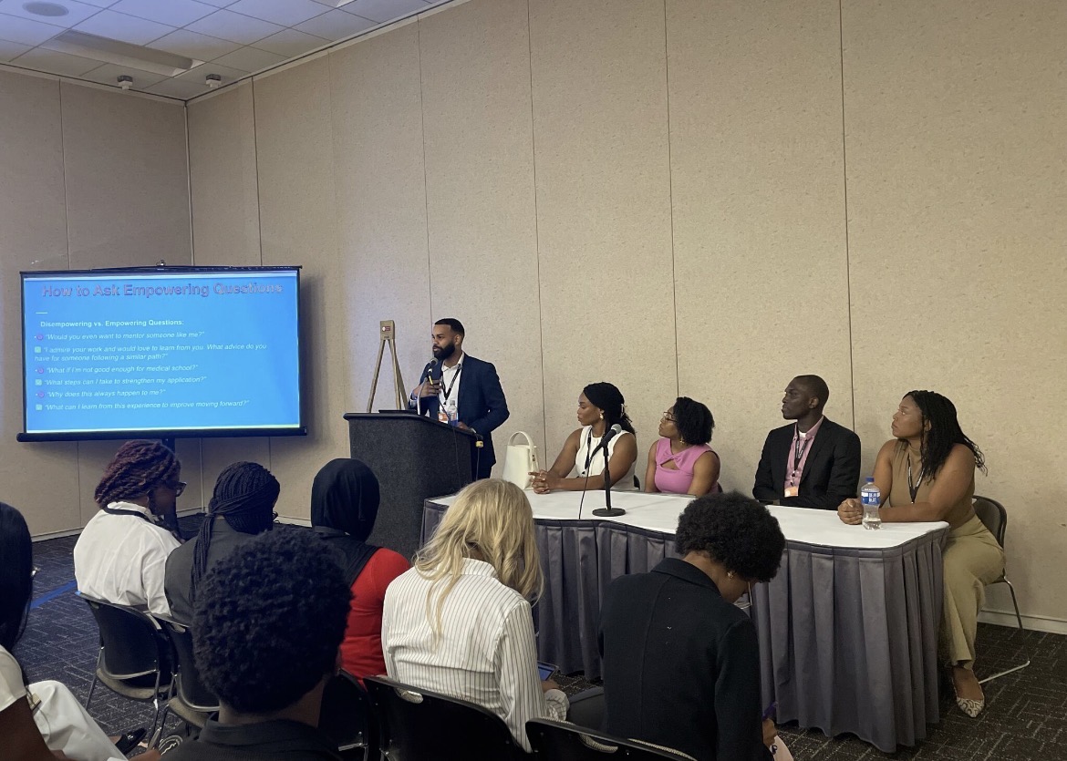 Fares Siddig leading the AMEC 2025 networking workshop with panelists